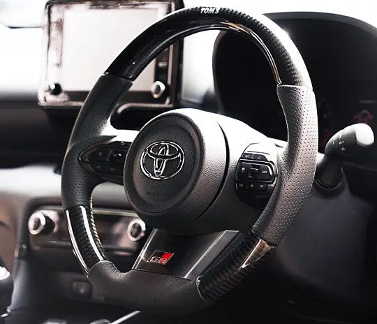 Tom's Japan 2020-2025 Toyota Gr Yaris Carbon Fiber And Gun Grip Racing Steering Wheel 1